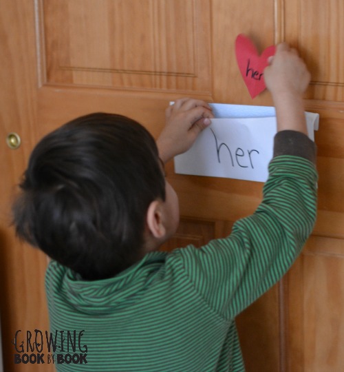 placing the hearts in the sight word envelopes