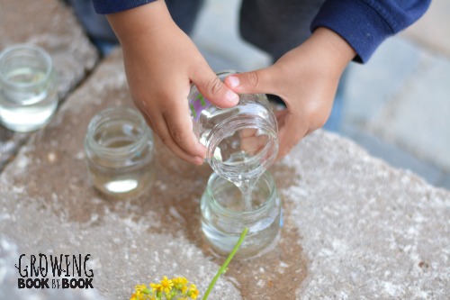 filling the alphabet vases with water