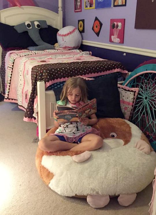 Create a reading nook at the end of a bed.