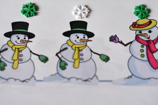 Use snowflake stickers in a snowmen counting book.