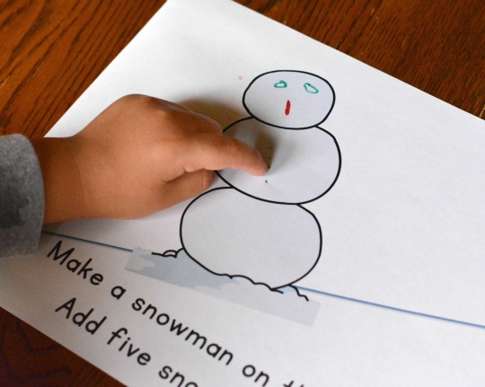 adding snowman details to a free printable book for early readers