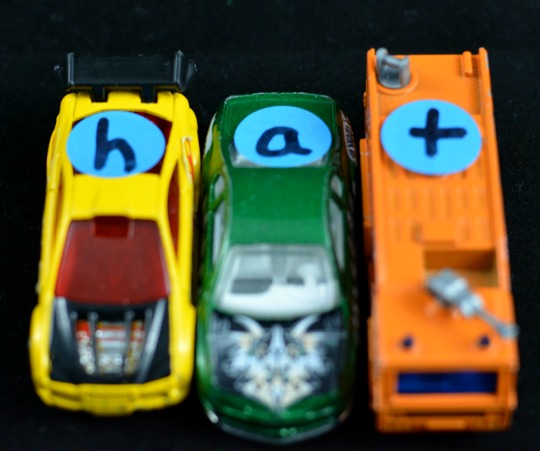 Add letters to cars for a hands-on phonics activity.