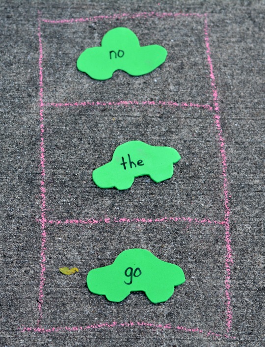 outside activity using chalk, foam sheets, and the tradition red light green light game