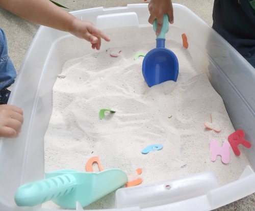alphabet sensory dig with sand