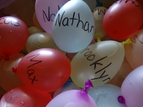 learning your name with water balloons from growingbookbybook.com