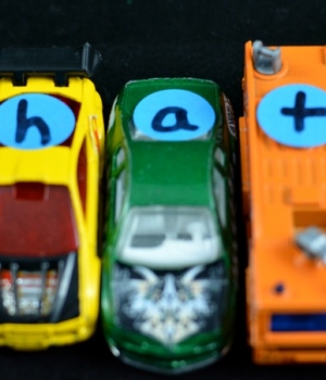 Add letters to cars for a hands-on phonics activity.